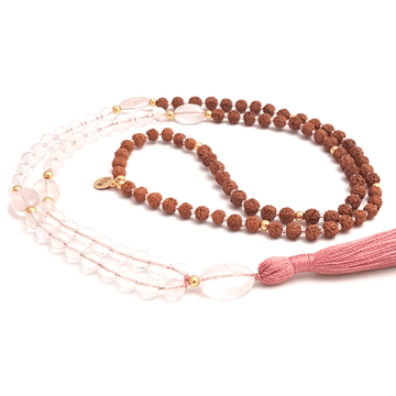 Handmade Rose Quartz Mala Necklace – Love, Healing & Heart Chakra Energy curled on table
